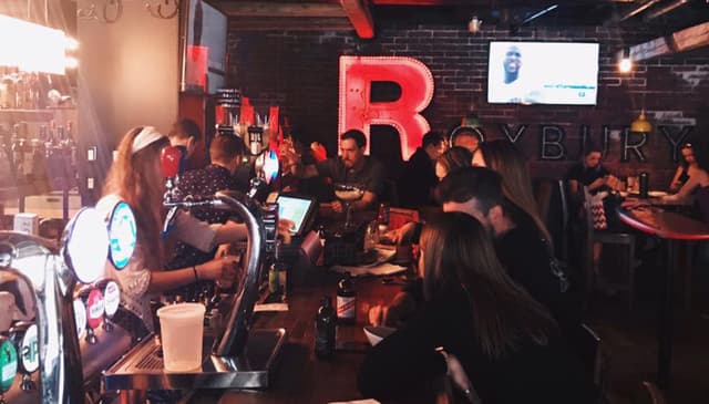 Guests inside The Roxbury Urban Dive Bar