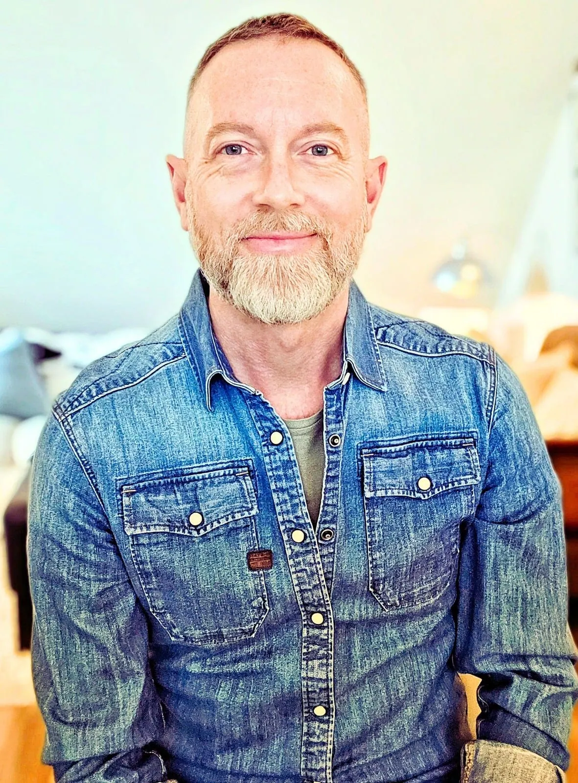 Portrait of Ryan MacGrath in a denim shirt