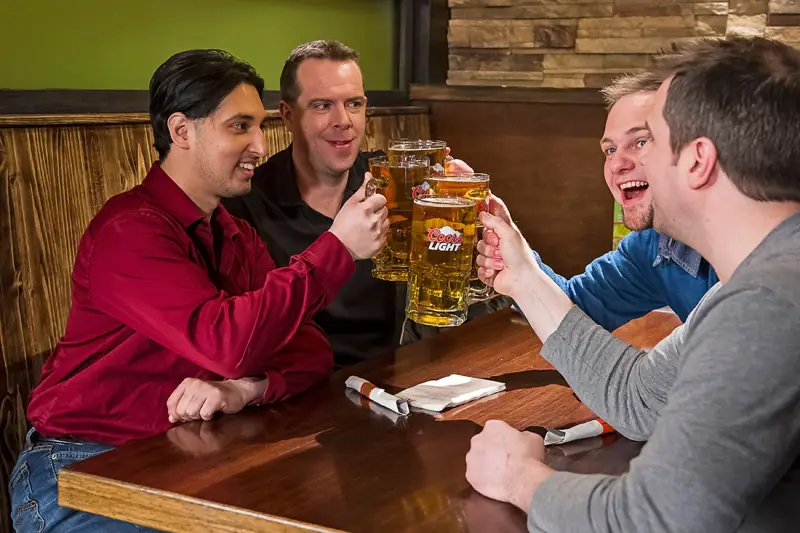 Friends toasting big drafts