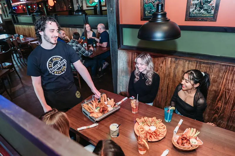 Server delivering platters to a table