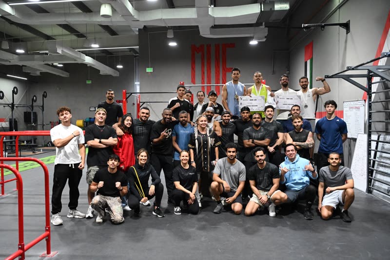 The whole group from the Ramadan Challenge posing on the gym floor