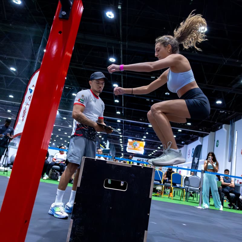 A competitor landing a box jump during the battle