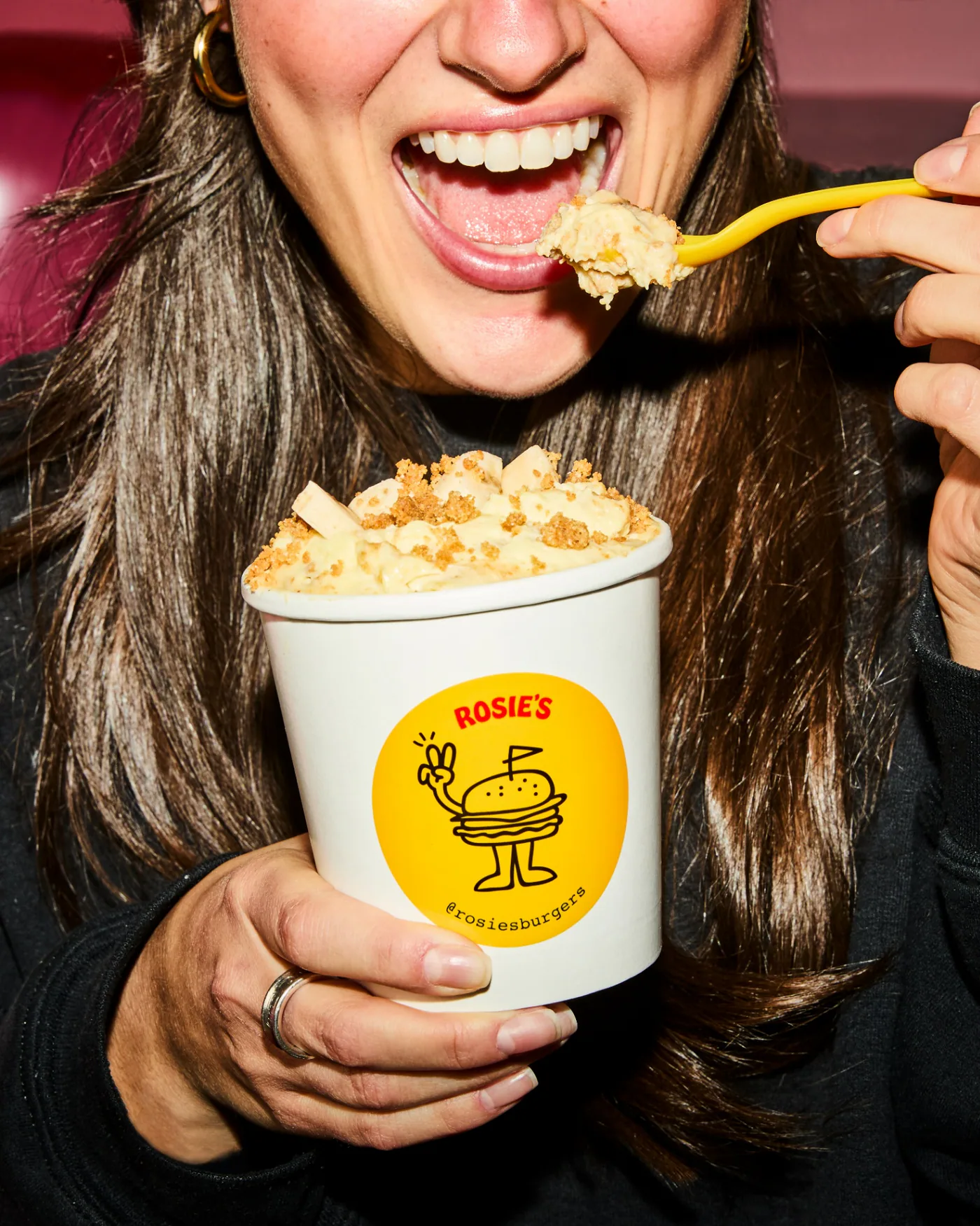 A customer taking a spoonful of banana pudding