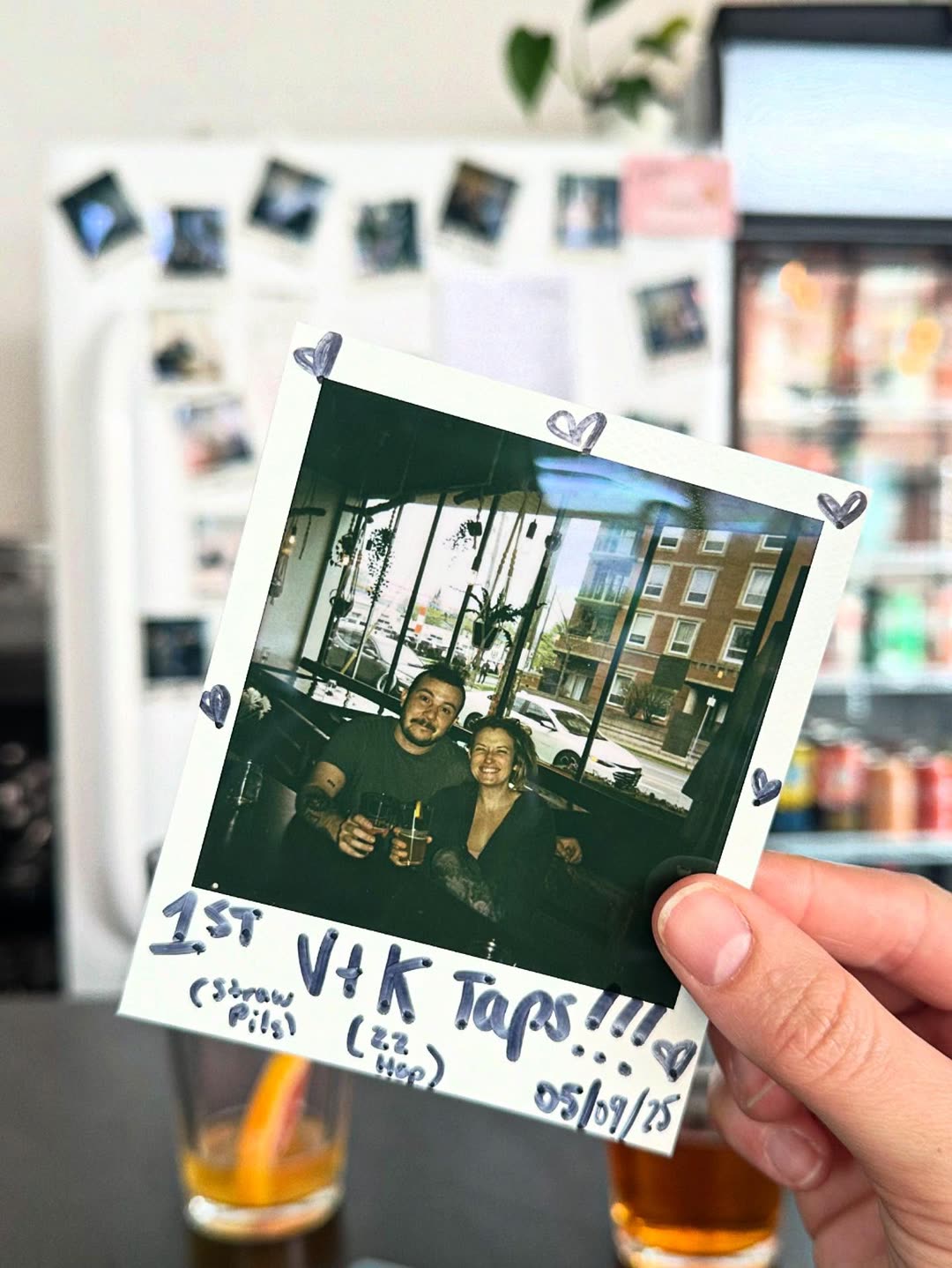 Polaroid of Vince's and Kristyn's first taps pinned on the wall