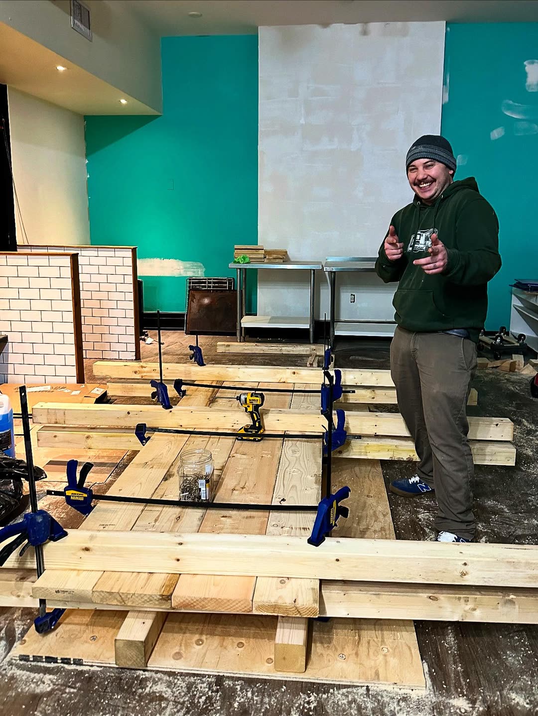 Vince with the table frames clamped up in the dining room